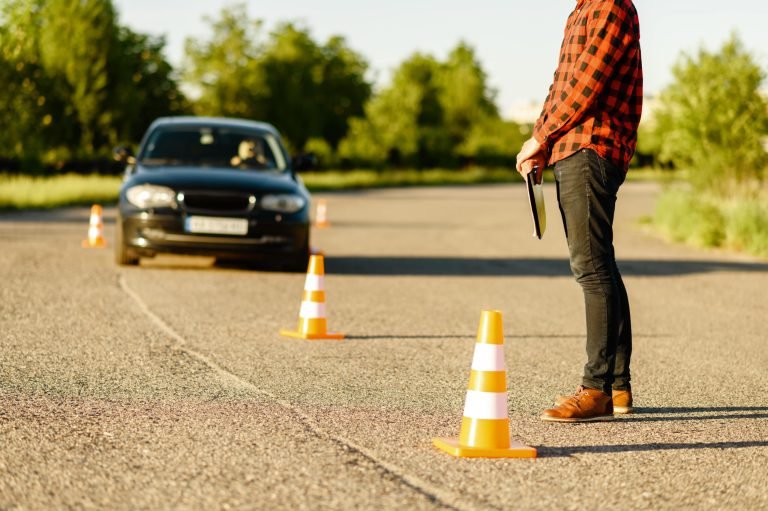 male-instructor-car-goes-between-the-cones-2021-08-28-20-00-45-utc-min